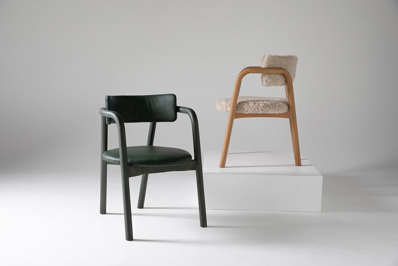 two chairs made of wood sheepskin and leather